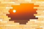 Crashed Brick Wall With Beautiful Sun Set Over The Sea Behind Stock Photo