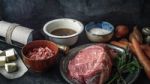 Ingredients For Boeuf Bourguignon On The  Dark Stone  Table Horizontal Stock Photo