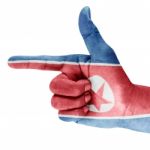 North Korea Flag On Hand Stock Photo