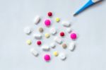 Top View Of The Pills On The White Background, The Drug And Capsule Pills On The Floor Stock Photo