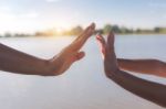 Two Hands Holding Puzzle Stock Photo