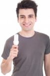 Man Holding Lightbulb Stock Photo