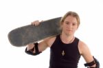 Male Holding Skateboard On Shoulder Stock Photo