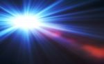 Abstract Large Lens Flare Light Over Black Background Stock Photo