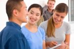 Group Of Happy Friends With Digital Tablet Stock Photo