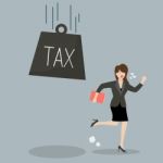 Business Woman Run Away From Heavy Tax Stock Photo