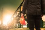 Engineering Man And Safety Helmet Standing Against Beautiful Lig Stock Photo