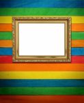 Gold Picture Frame On Colorful Wood Stock Photo