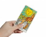 The Sun, Isolate Of Hand Holding Tarot Card Stock Photo