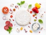 The Ingredients For Homemade Pizza On White Wooden Background Stock Photo