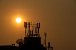 Sunset At Satellite Dish And Antenna Stock Photo