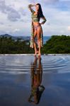 Pretty Brunette Model In Bikini Posing At The Pool Stock Photo