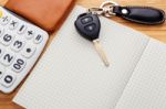 Car Key On Blank Notebook With Pocket Money Stock Photo