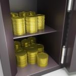 Open Safe With Coins Shows Safety Savings Stock Photo