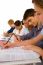 Teenage students Writing On book