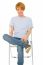 Teenage Boy Sitting On Chair