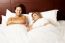 Nude Couple Relaxing In Bed