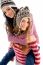 Young Girl Giving Piggyback To Her Friend