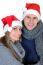 Smiling Couple In Santa Claus Hats