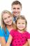 Parents Posing With Cute Smiling Daughter