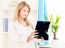 Woman Holding Frame Of Photo At Home