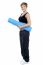 Smiling Female Instructor Carrying A Blue Yoga Mat