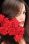 Woman And Red Carnations