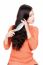 Woman Combing Her Long Black Hair