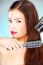 Woman Holding Blow Dryer And Comb