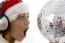 Surprised Woman Looking To Disco Ball And Wearing Christmas Hat