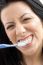 Close Up Of Woman Brushing Her Teeth