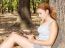 Girl In Park With Tablet Computer