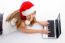 Laying Young Female With Christmas Hat And Laptop