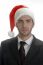 Close Up View Of Businessman In Santa Cap