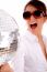 Side Pose Of Shouting Woman Holding Disco Ball