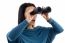 Portrait Of Woman Looking Through Binocular On White Background