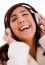 Portrait Of Smiling Young Female Enjoying Music