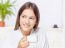 Woman In Bathrobe Relaxing At Home