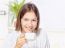 Woman In Bathrobe Relaxing At Home