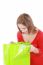 Surprised Brunette Woman Holding Opened Shopping Bag