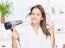 Woman Drying Hair At Home