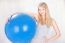 Woman Holding Blue Pilates Ball