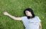 Young Model Laying In The Grass