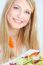 Blond Woman Eating Salad