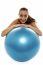 Woman Leaning Over Big Blue Swiss Ball