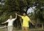 Happy Mother And Father In The Park