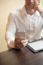 Man With Smartphone In Office