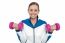 Happy Woman Carrying Dumbbells In Both Hands