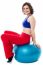 Woman Relaxing On Big Exercise Ball After Workout