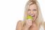 Closeup Shot Of A Blonde Woman Biting An Apple